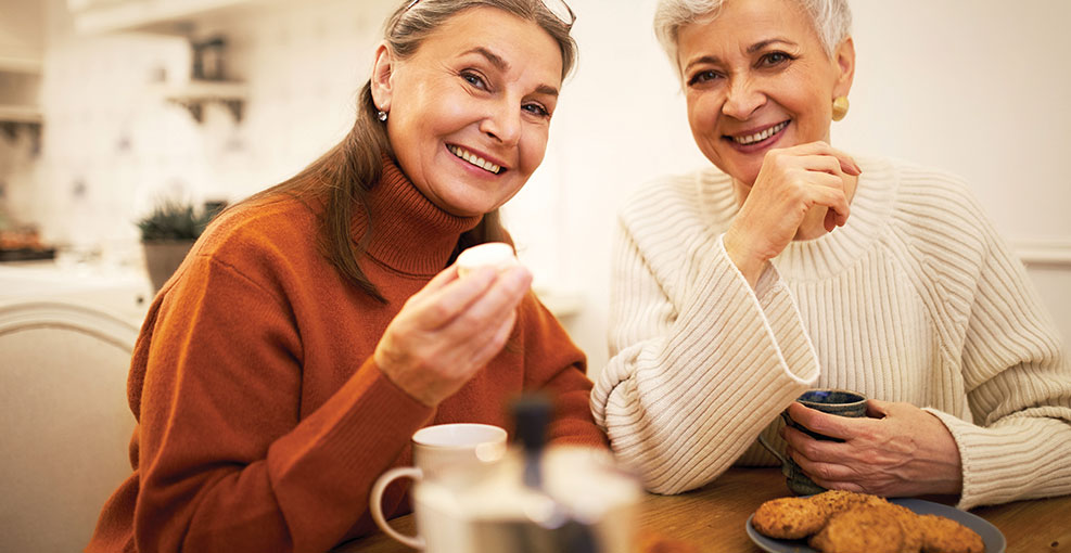 Two women having a cup of tea together